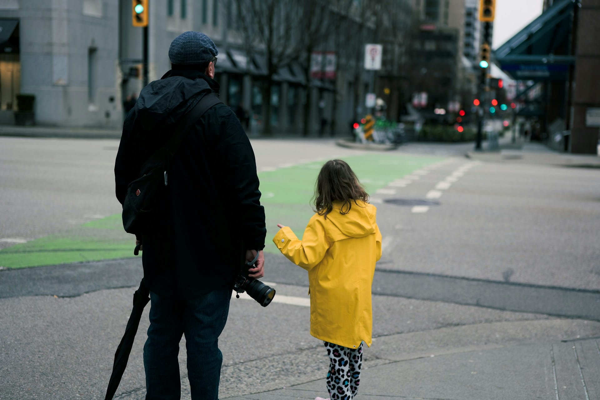 dad and daughter in city