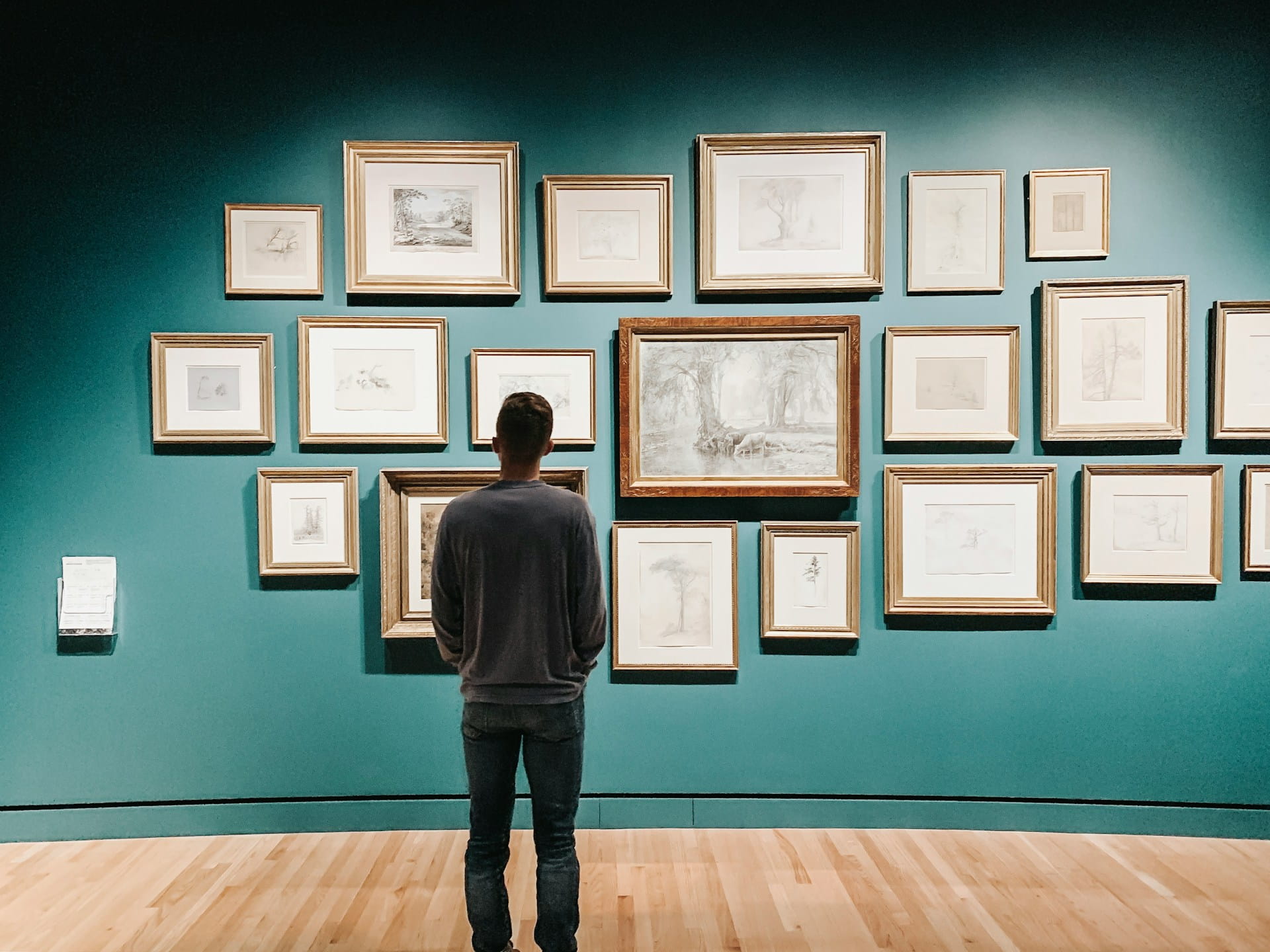 man looking at scripture un museum