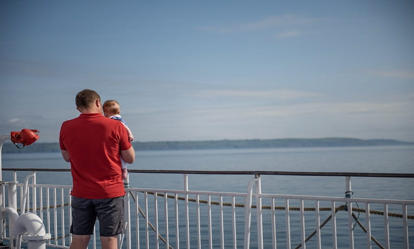 Man and baby travelling by ferry