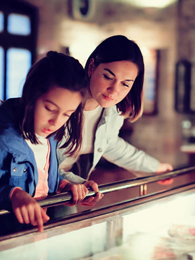 Mother and daughter visiting a museum