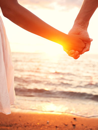 Couple walking along a beach