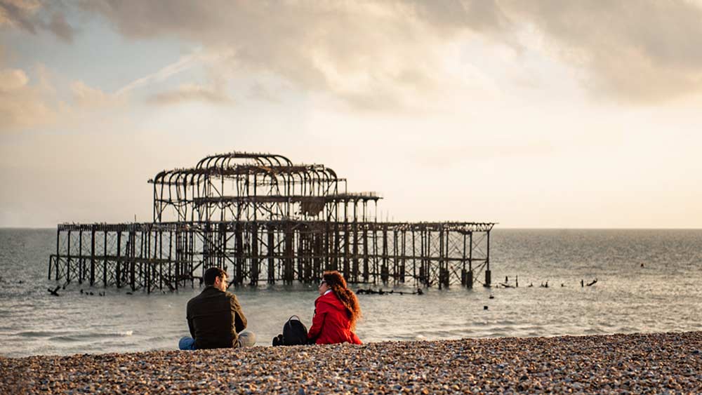 Couple relaxing at Brighton Beach Old Pier