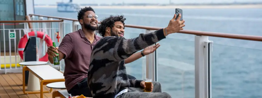 Friends on deck looking to sea