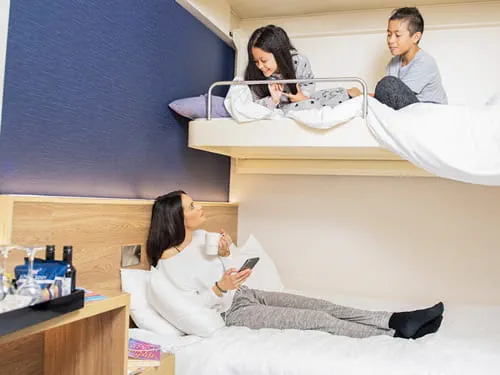 Mother with two children in P&O Family Club Cabin