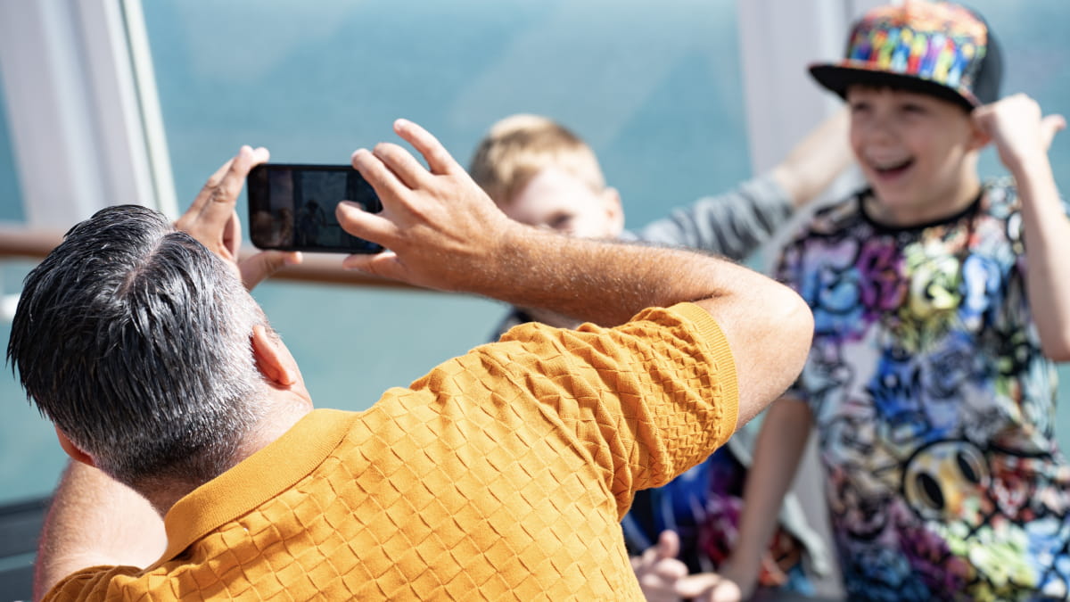 Family taking a photo on P&O Ferry deck in the sunshine