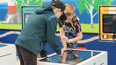Children playing on P&O Ferries ship on an interactive game