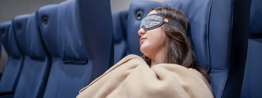 Person sleeping on reclining seat