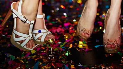 "Sunset Show Bar - two girls dancing close up of their high heels with confetti"
