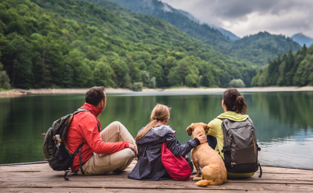 family hiking with dog