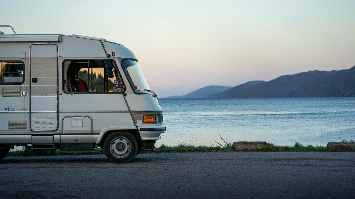 Motorhome parked next to a lake