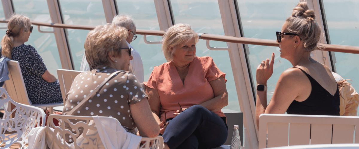 People sat outside on ferry