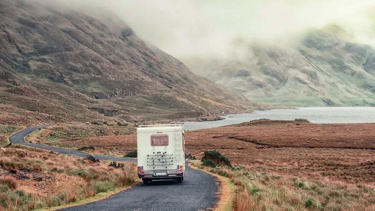 Motorhome travelling to Ireland on road through mountains