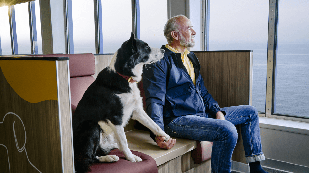 Man and dog in pet lounge