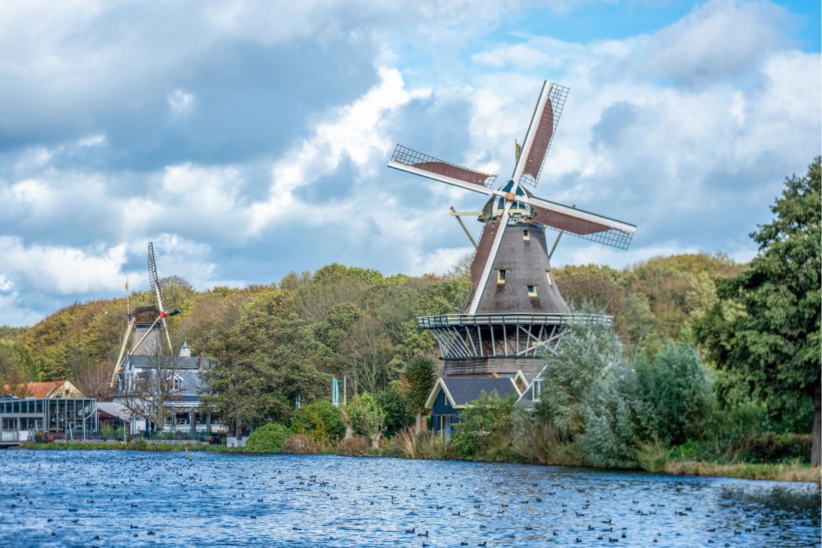 Windmill overlooking a river in the Netherlands